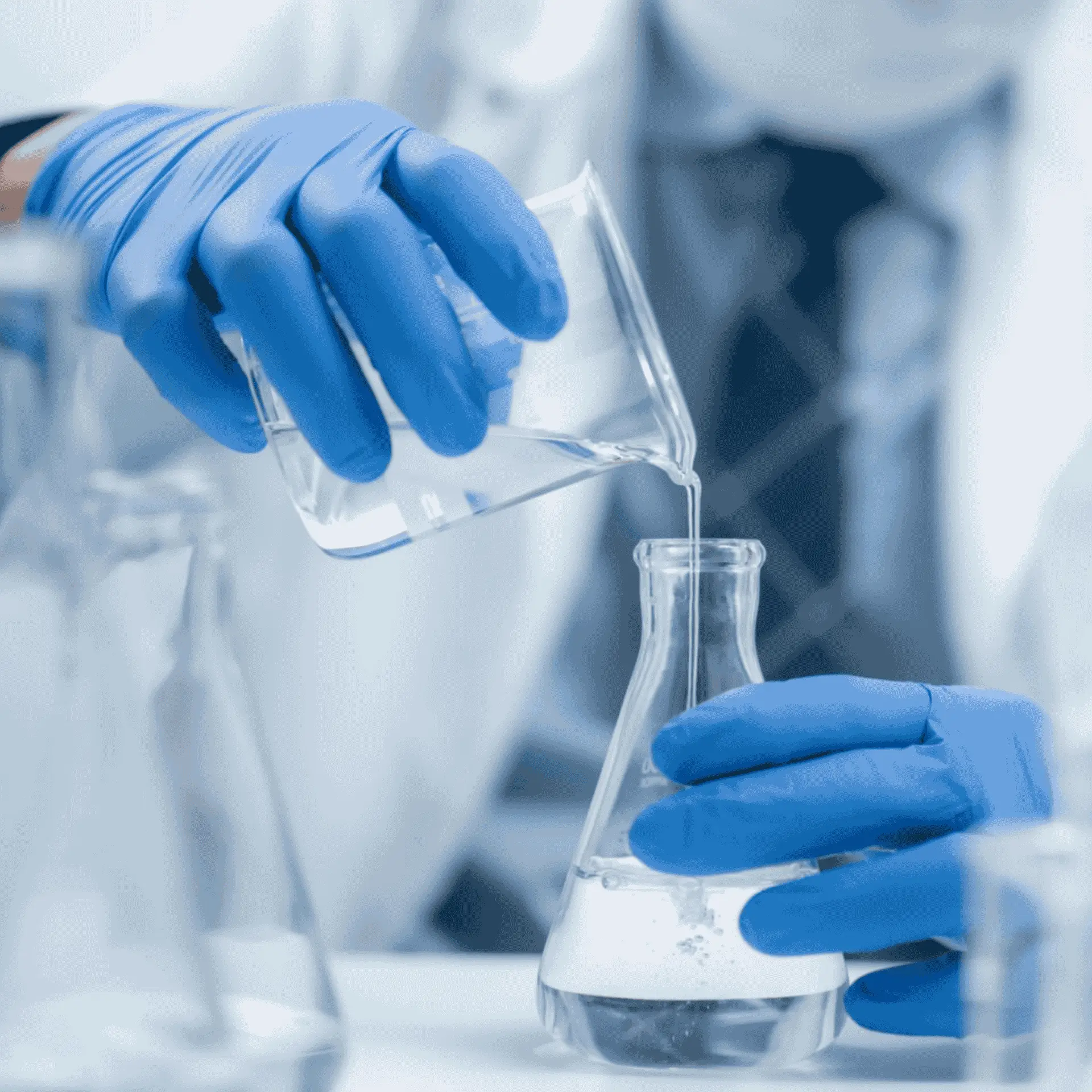 TUODA lab technicians pouring chemical reagents for pharmaceutical catalyst research