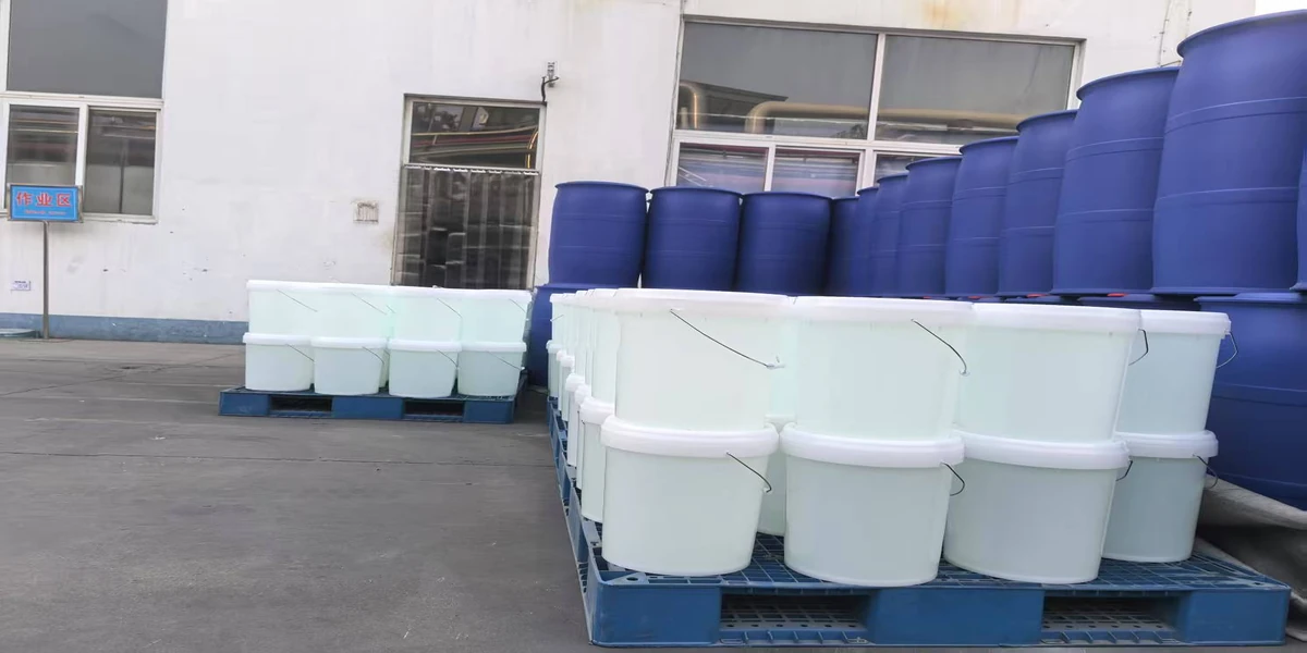 4-Methylmorpholine drums and QC sample in industrial chemical warehouse, 1200x600